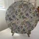 Large round ceramic plate with floral decoration – Arts & Crafts style