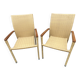 Pair of colonial-style rattan and wood armchairs