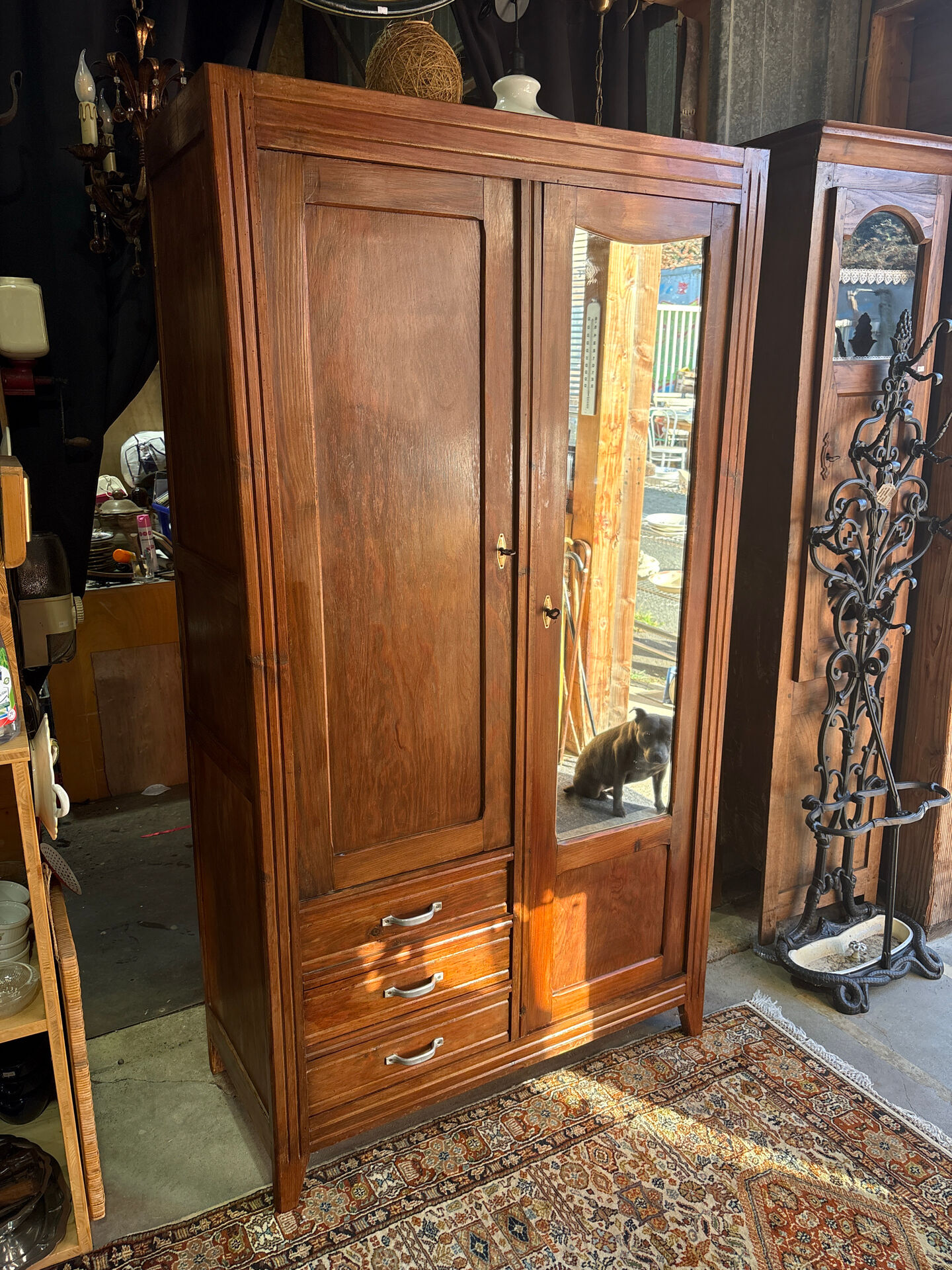 Antique Parisian wardrobe with mirror, hanging space and drawers.