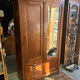 Antique Parisian wardrobe with mirror, hanging space and drawers.