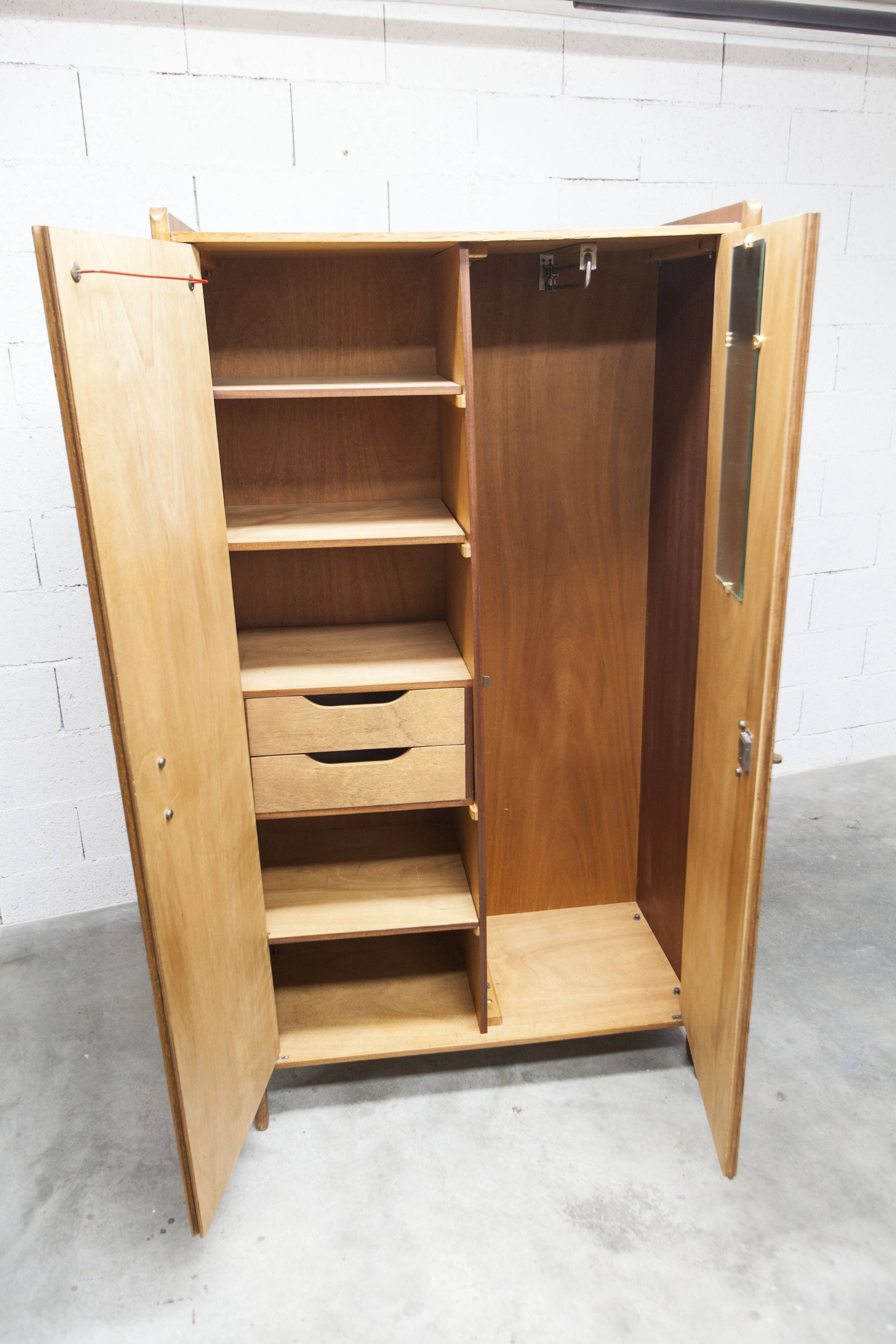 1950s Mid-Century Modern oak armoire with two doors and two drawers.