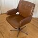 Vintage swivel chair in wood and leather