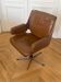 Vintage swivel chair in wood and leather