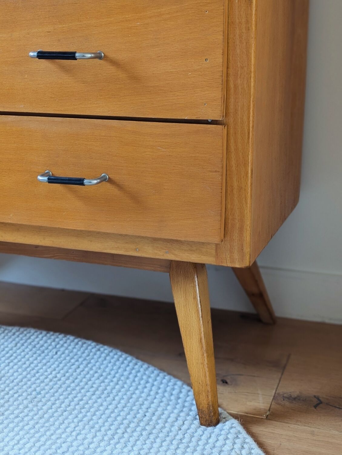 Vintage chest of drawers with tapered legs from the 1960s.