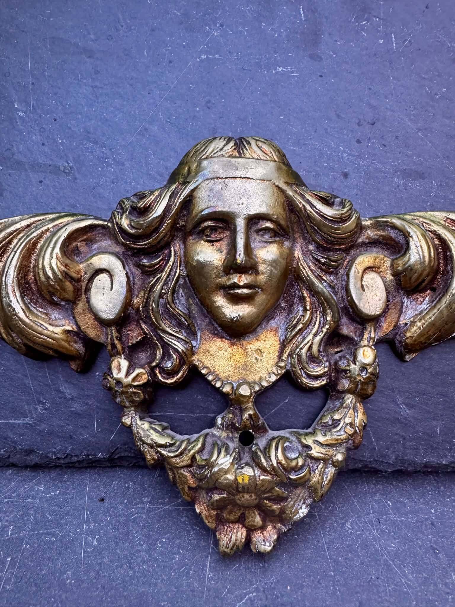 Large bronze fronton with Art Nouveau caryatids.