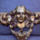 Large bronze fronton with Art Nouveau caryatids.