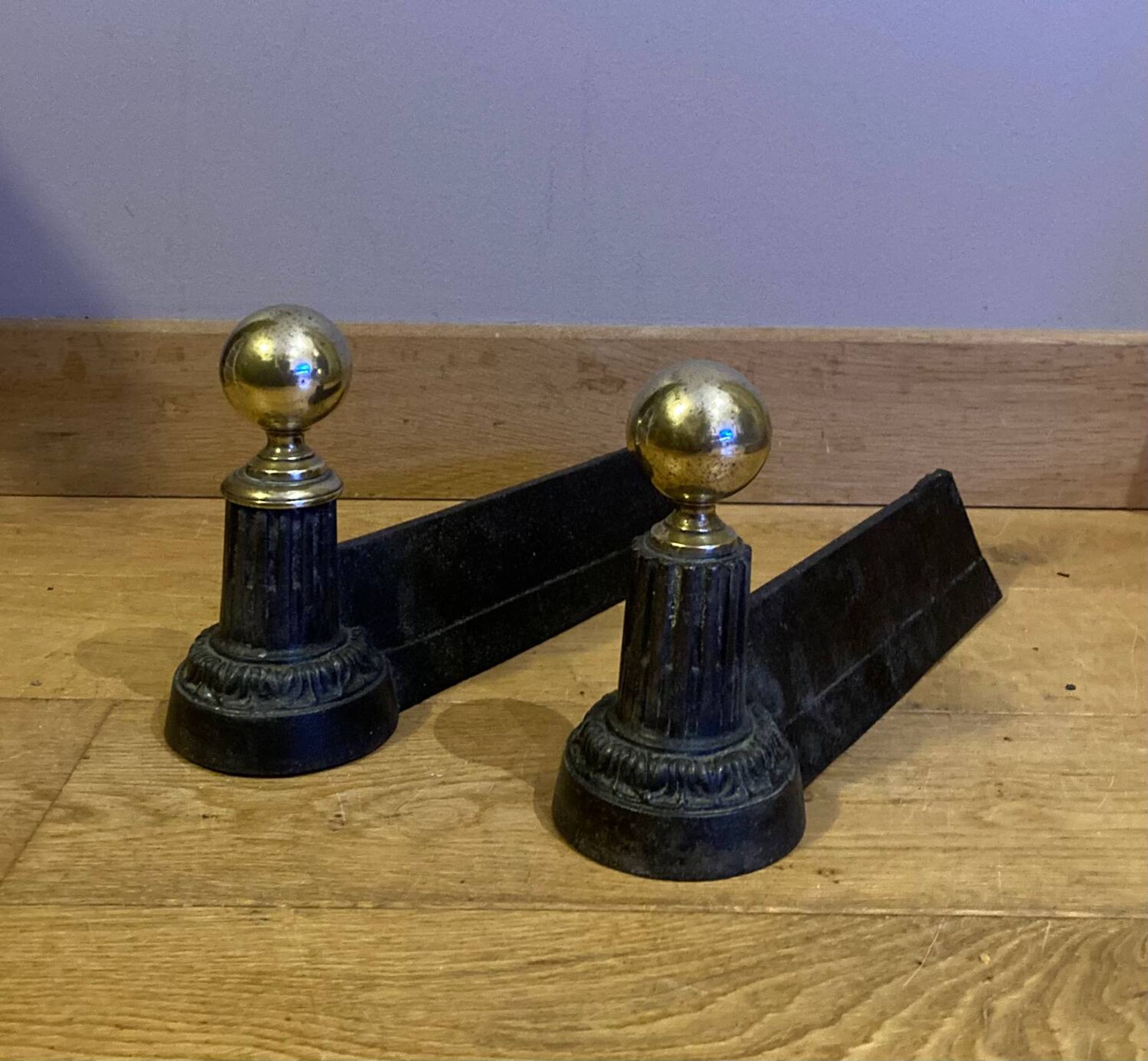 Pair of Napoleon III andirons from the 19th century in cast iron and brass