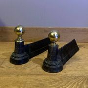 Pair of Napoleon III andirons from the 19th century in cast iron and brass