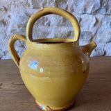 Jug or chevrette in yellow glazed stoneware