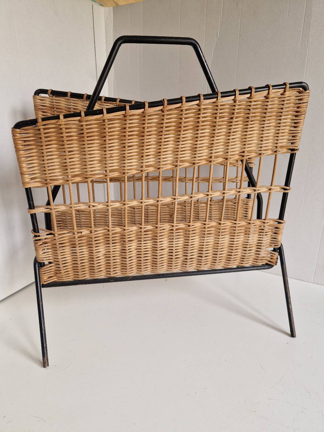 Raoul Guys magazine rack 1950s  
Rattan and black metal