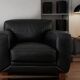 Leather sofa and armchair in black cowhide, brand Steiner.