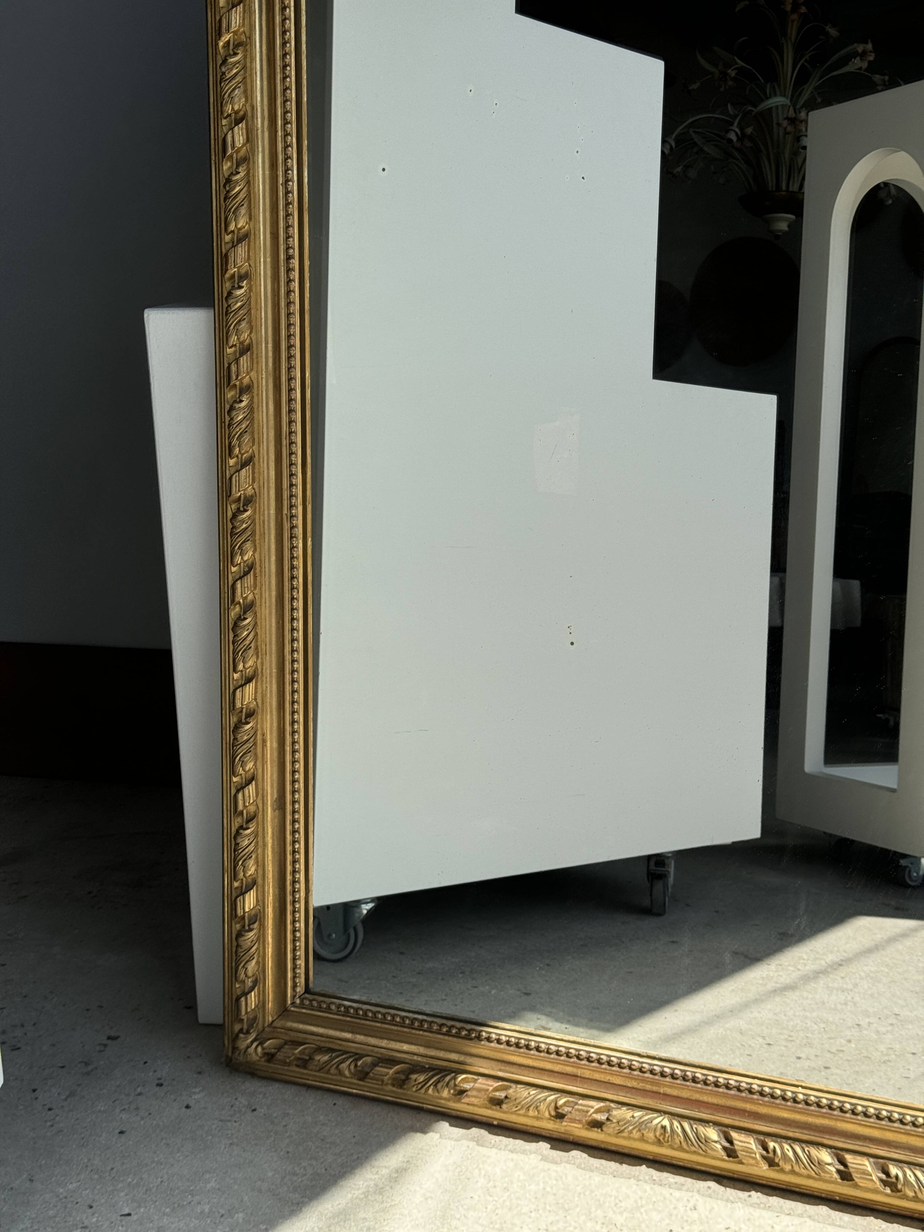 Large gilded mirror with acanthus leaf pediment H150 L98