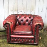 Pair of red leather chesterfield chairs