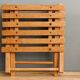 Lathy folding stool made of wood