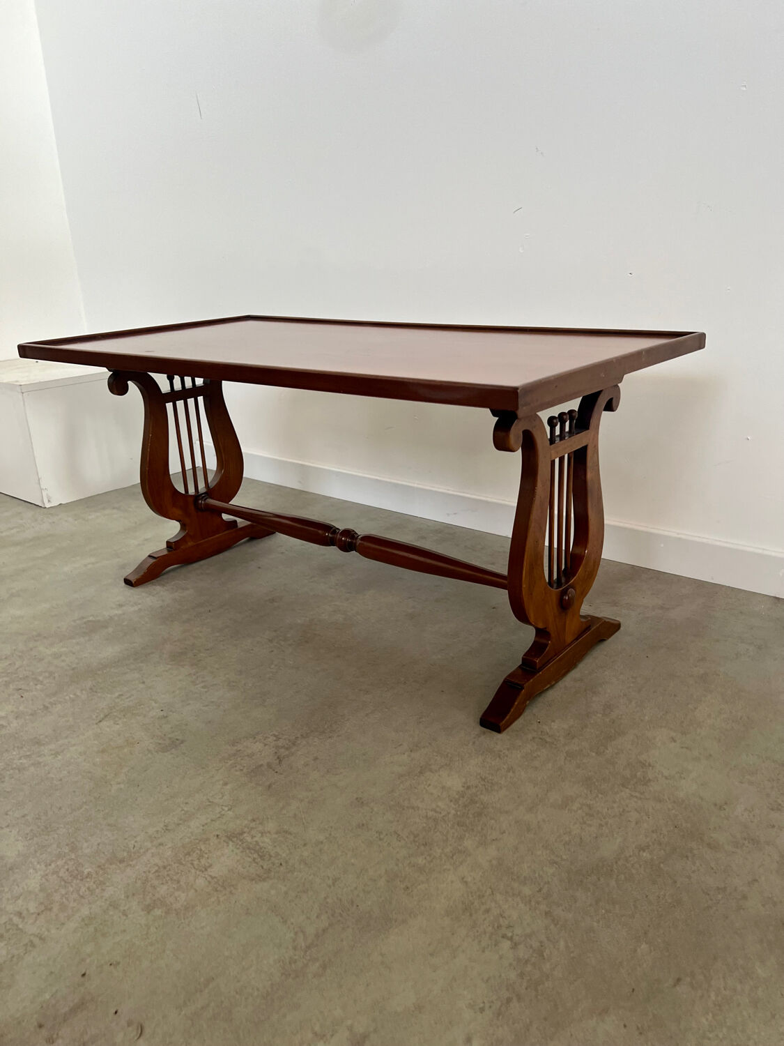 Old rectangular wood coffee table with lyre side posts