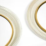 Pair of Mid Century wall mirrors with brass rim and white metal frames