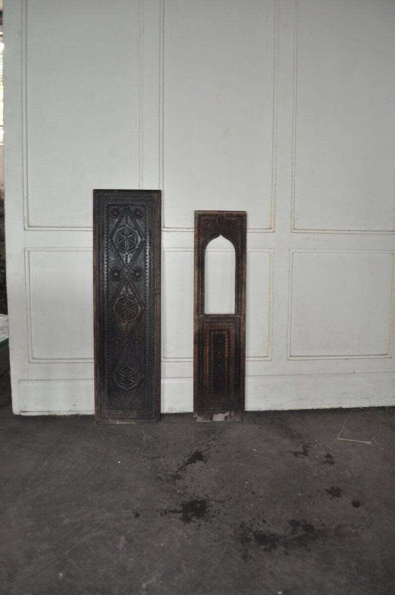 Set of 2 carved brown wooden panels, rural Hungary, 1940s, geometric patterns.