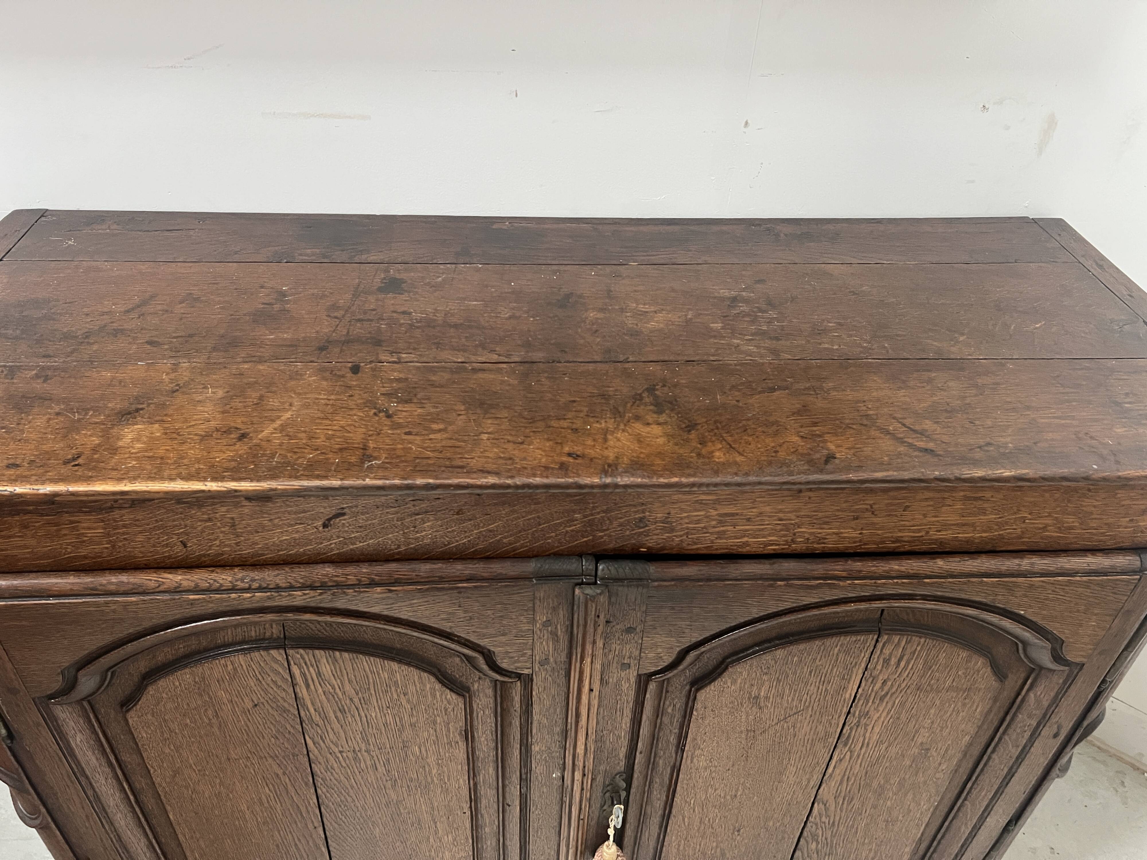 Two-door buffet in solid oak, Louis XIV style, 18th century.