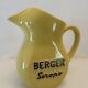 Old yellow pitcher anisette berger syrups, vintage bistro decoration