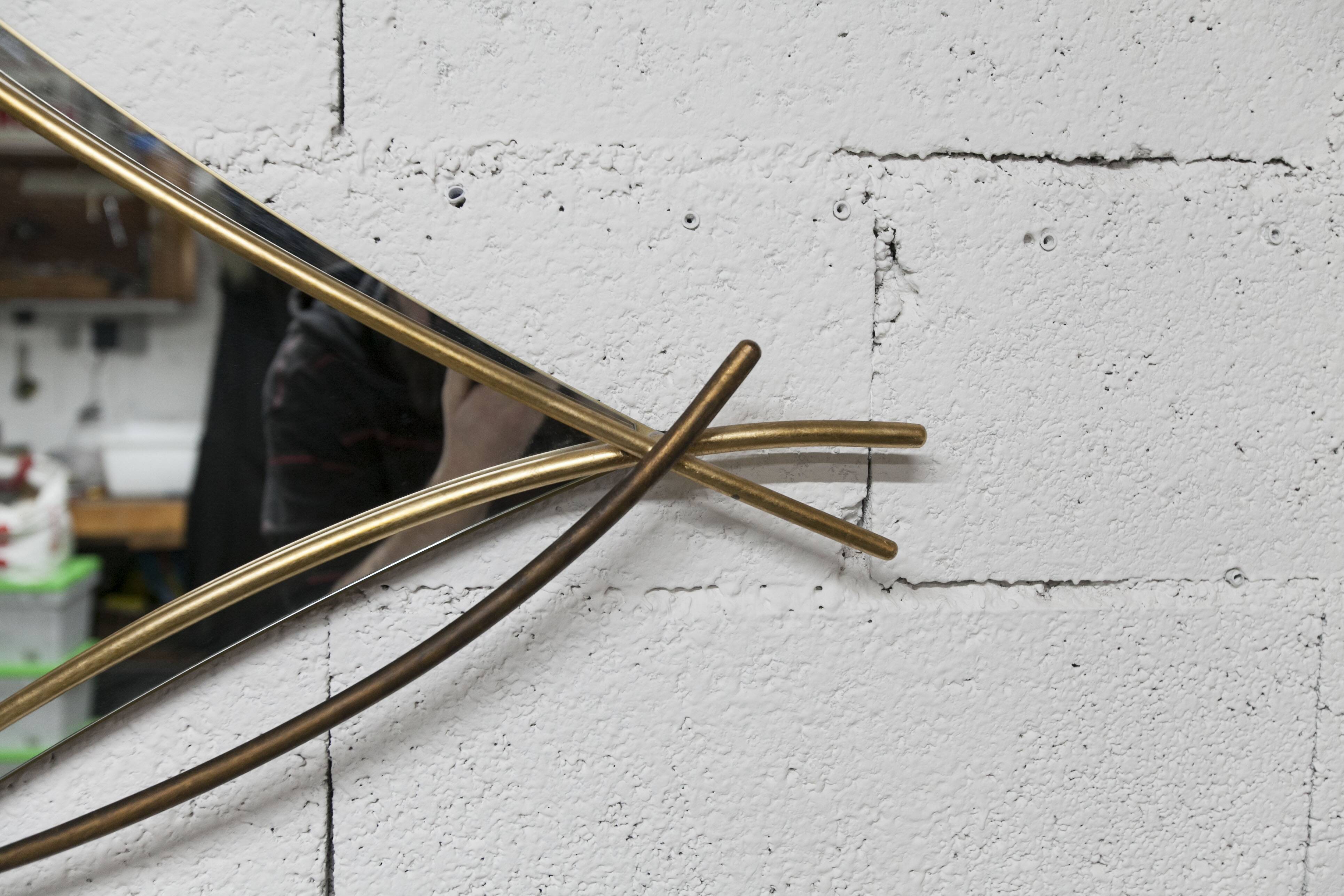 Sculptural mirror with two-tone gilded arches, France, 1970s, 95 x 133 cm