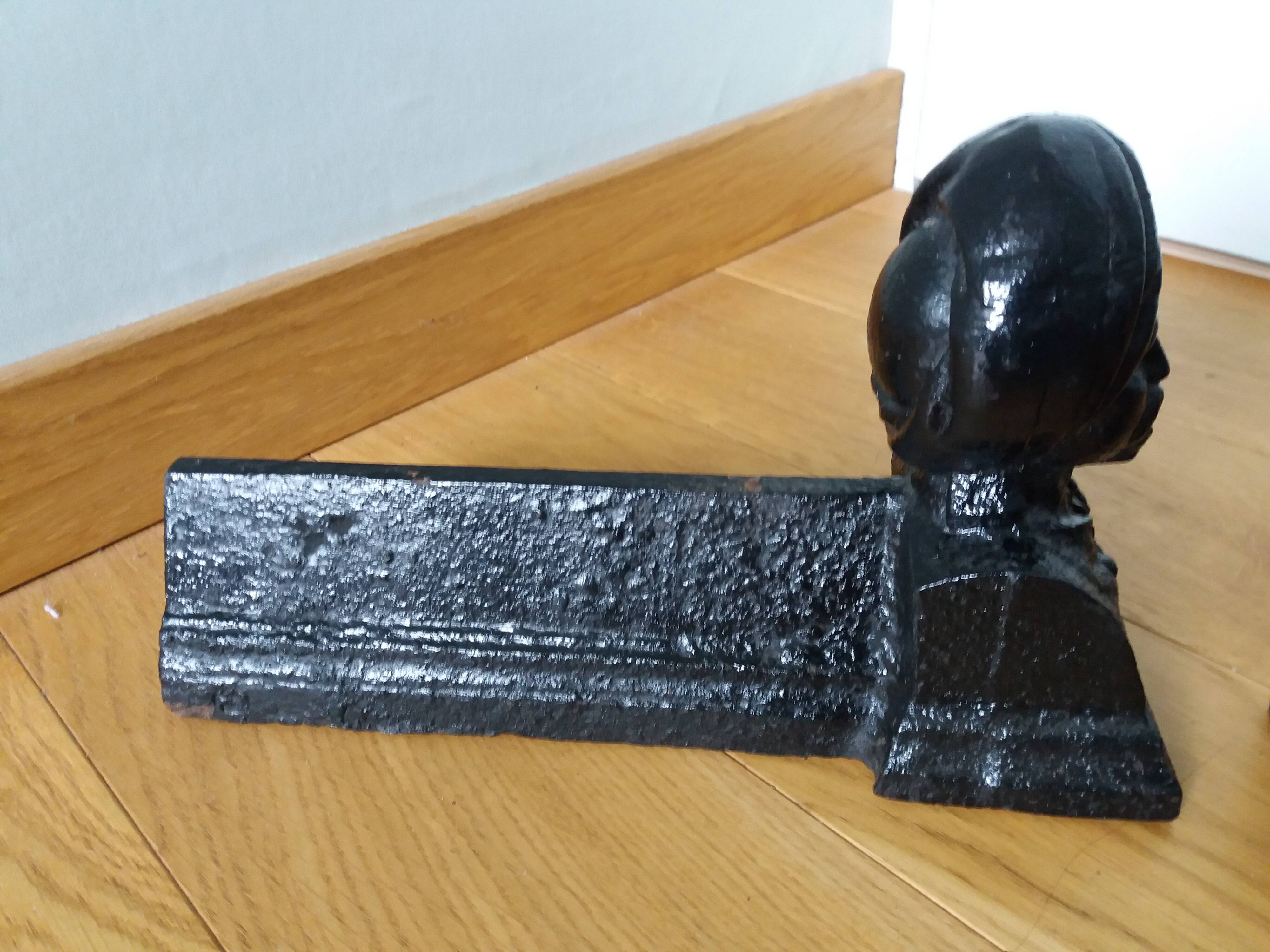 Cast iron andirons with character heads