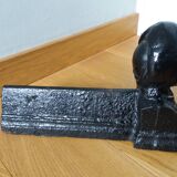 Cast iron andirons with character heads