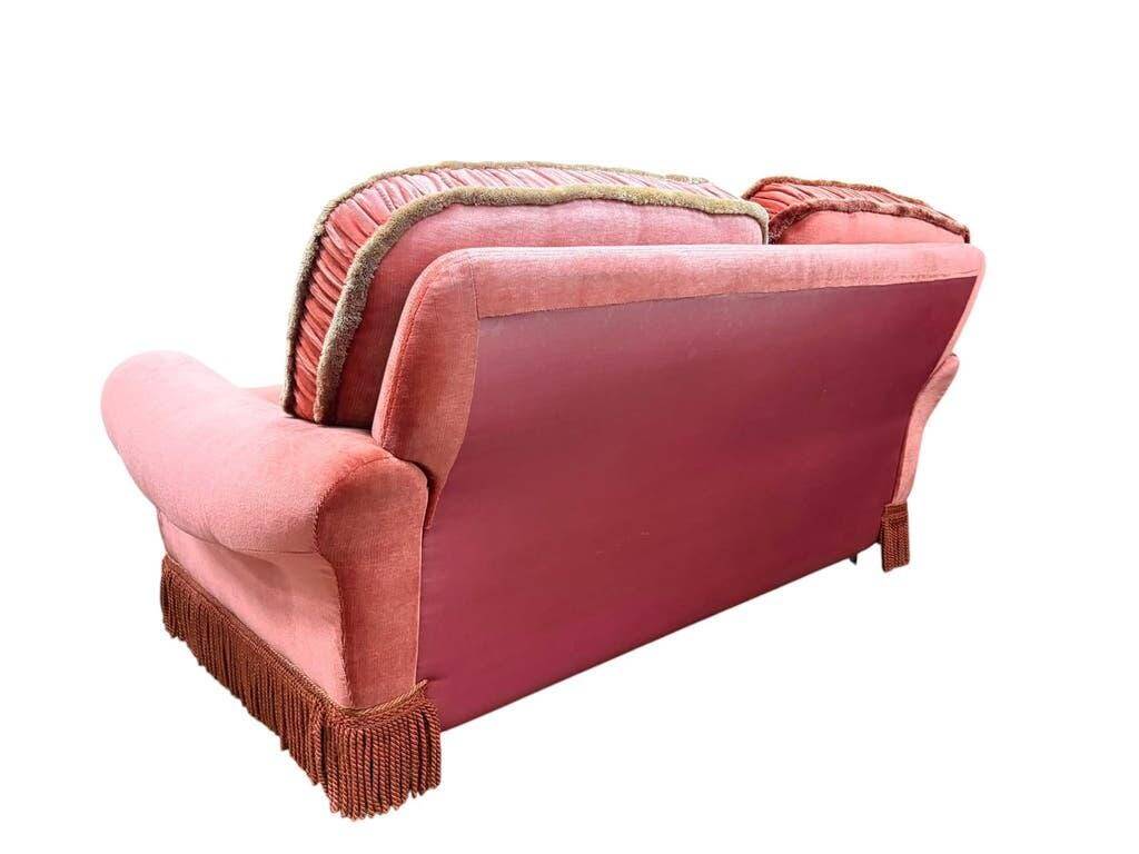 Vintage pink two-seater sofa with fringes