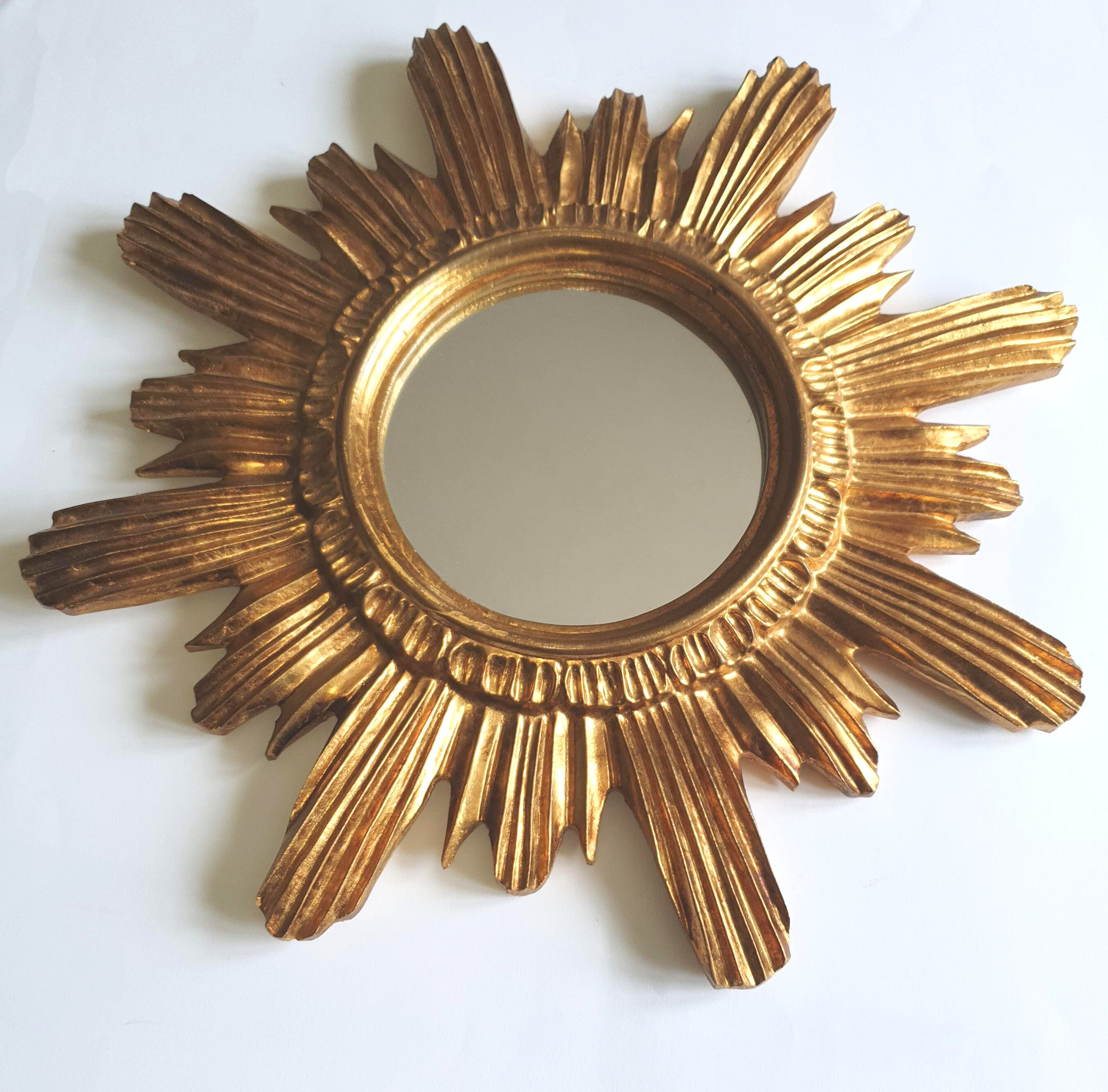 Sun mirror in gilded wood