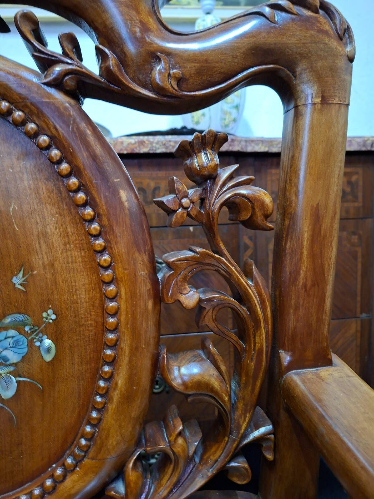 Pair of Asian armchairs in carved wood with mother-of-pearl inlays.