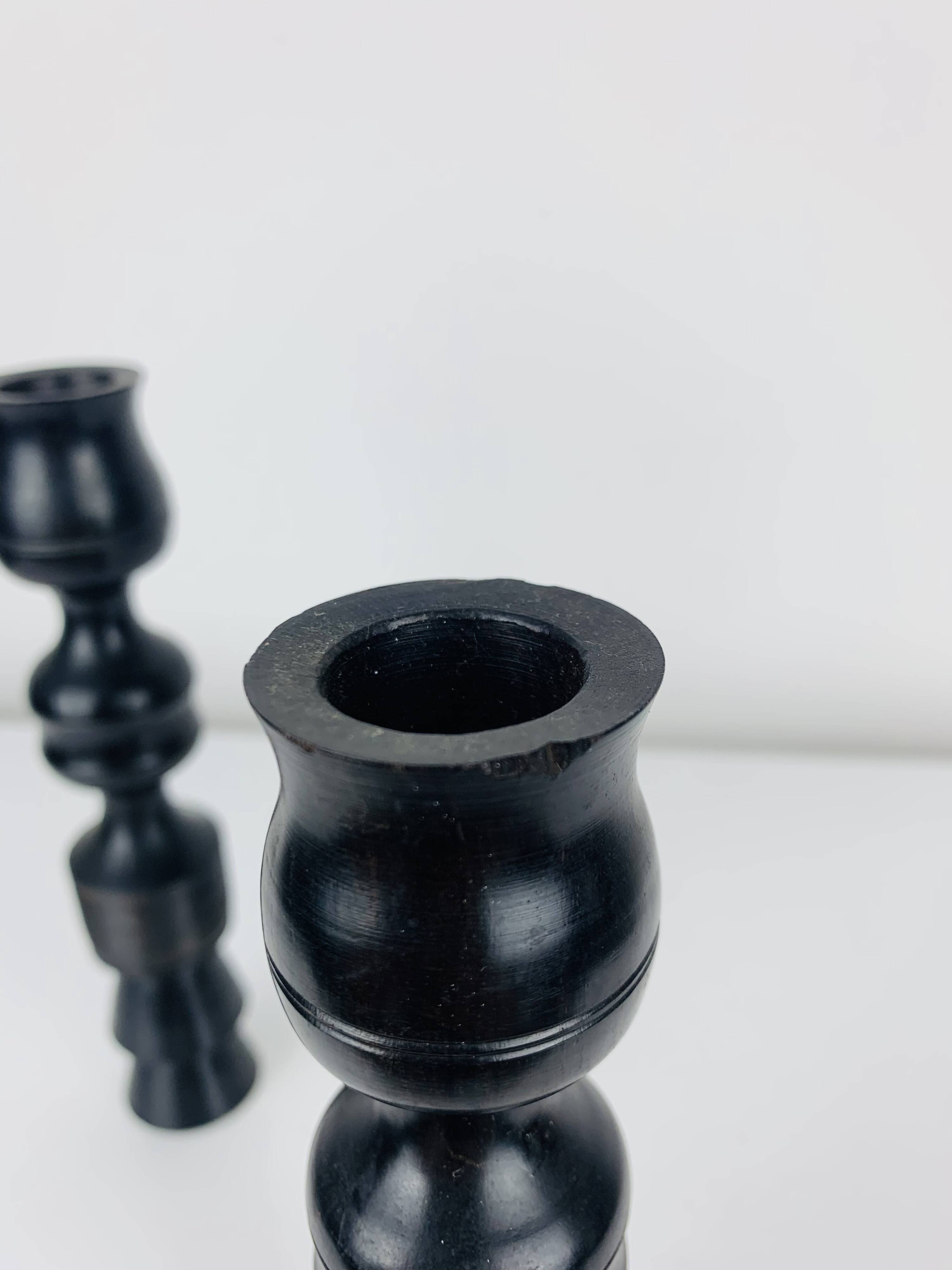 Pair of vintage ethnic blackened wood candlesticks