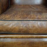 Fauteuil à oreilles en cuir de mouton