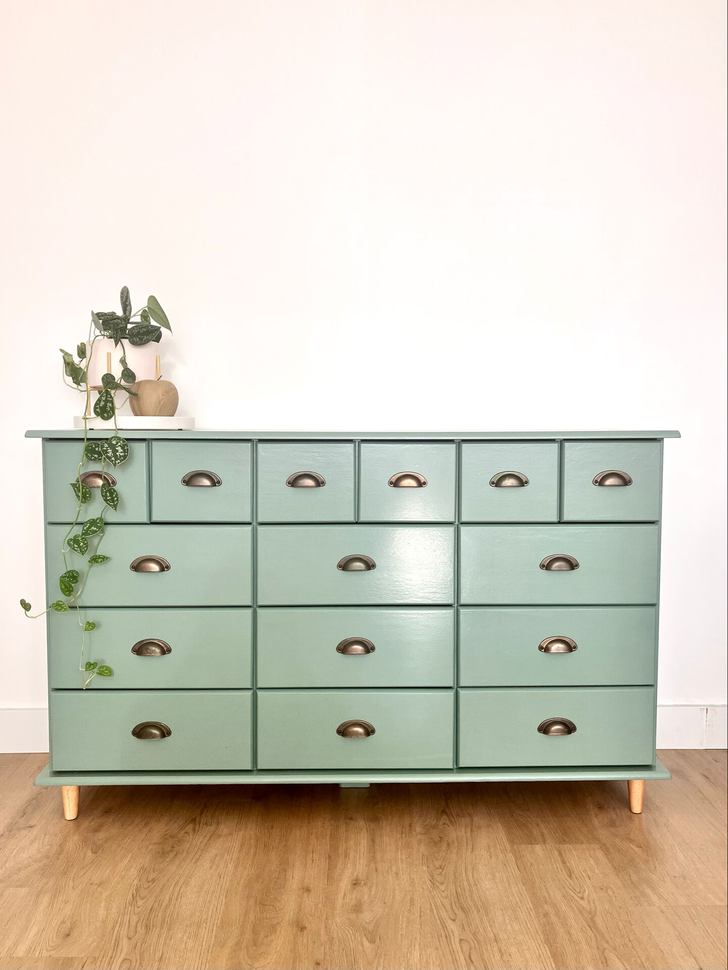 Low buffet with patinated gold handles.