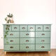 Low buffet with patinated gold handles.