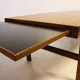 Table basse en teck avec feuille d'extension noire, design danois, années 1960.