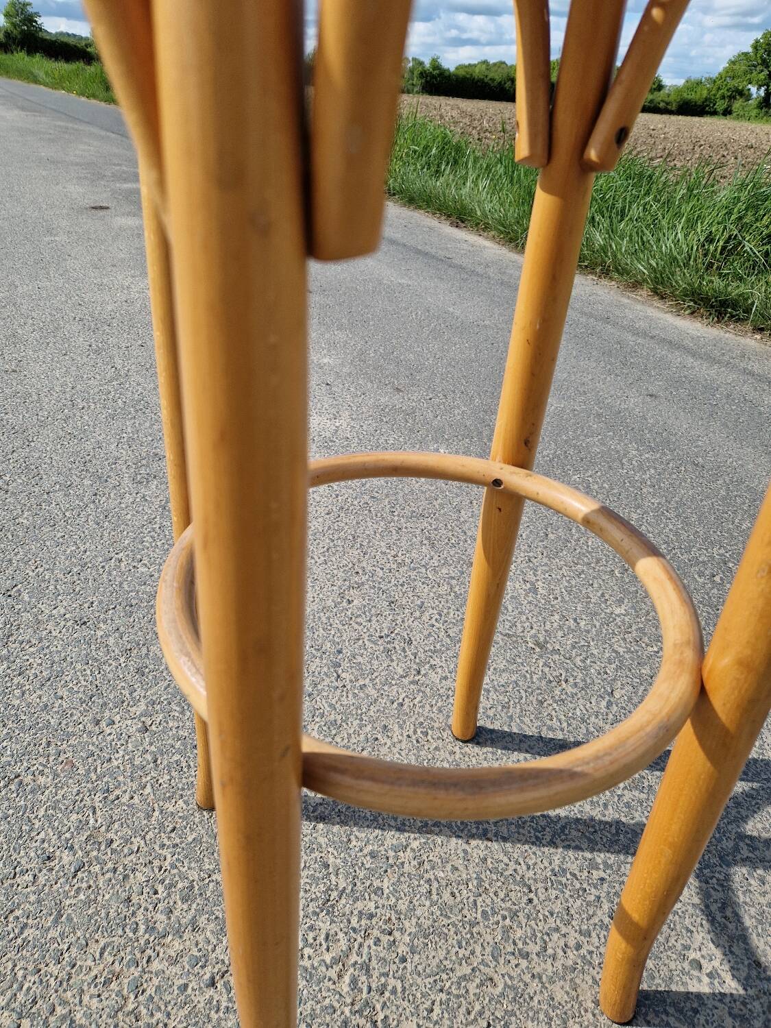 High bar stool in curved wood and cane