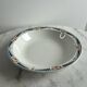 Longwy salad bowl with blue and orange floral decoration.