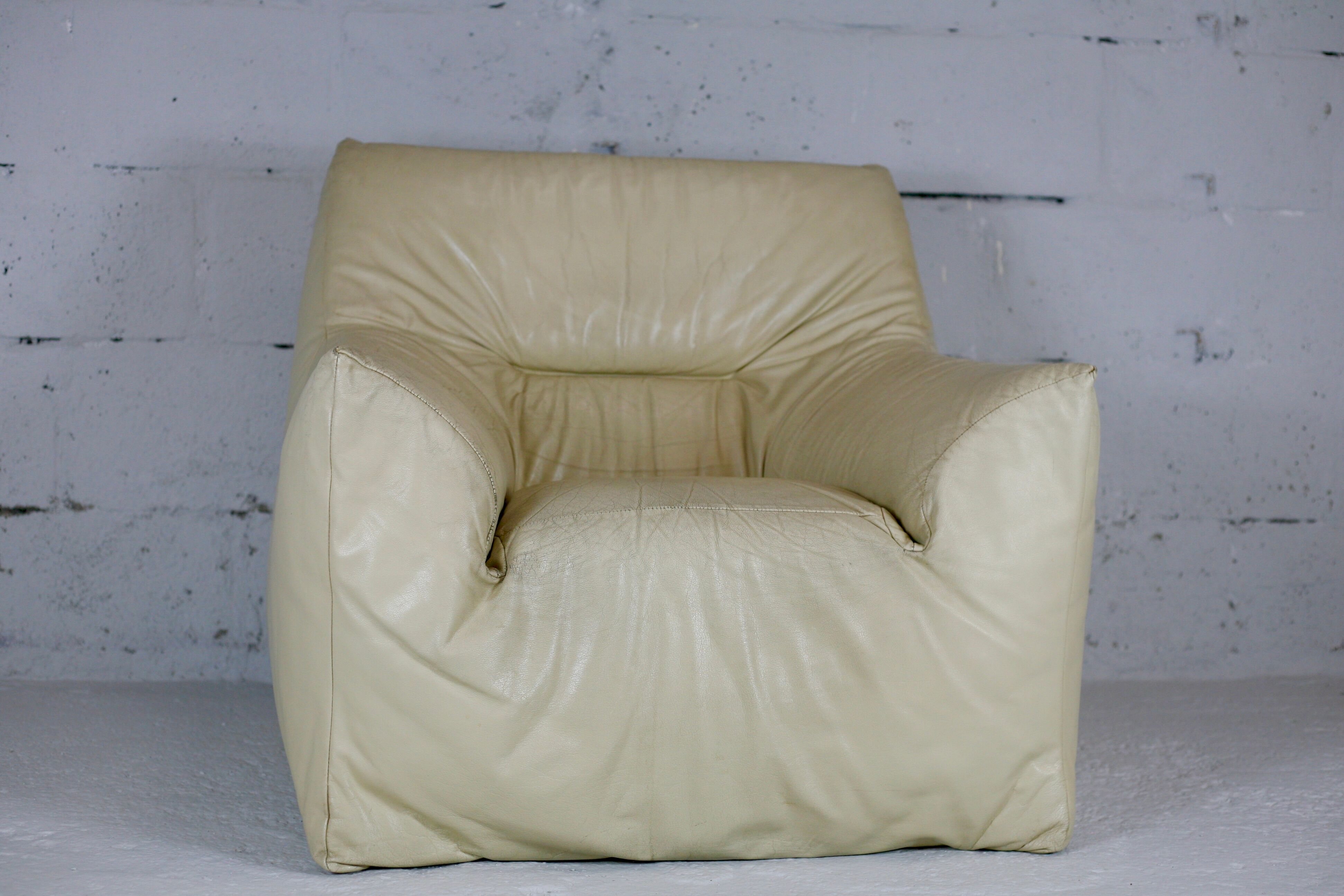 Leather armchair and cream-coloured foam, France , circa 1970