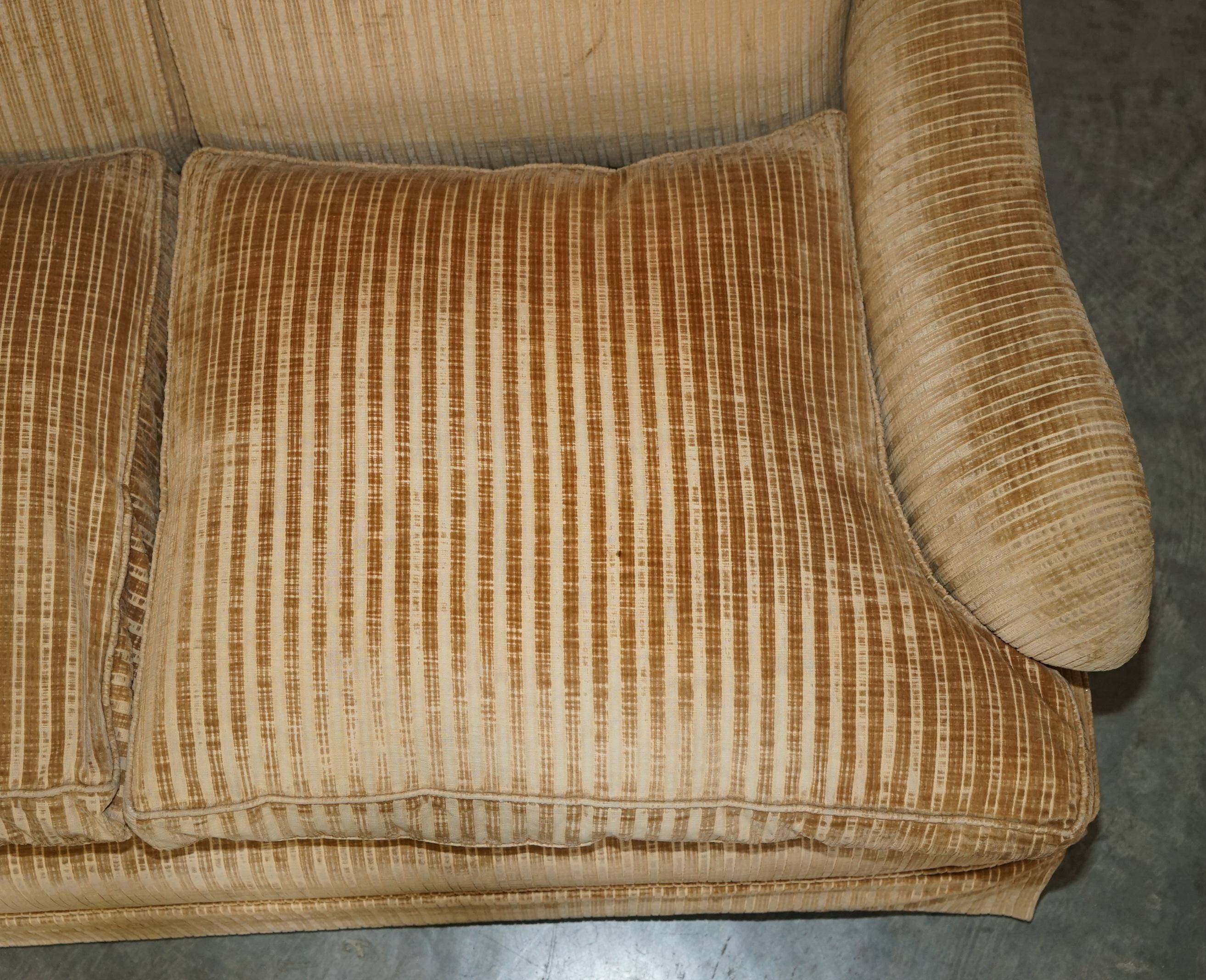 Howard & Sons / Chairs Ltd two-seater canapé with feather-filled cushions.