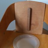 Baumann Baby Coquille children's armchair in bent wood with splayed legs.