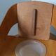 Baumann Baby Coquille children's armchair in bent wood with splayed legs.