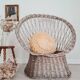 Antique armchair in gray woven wicker