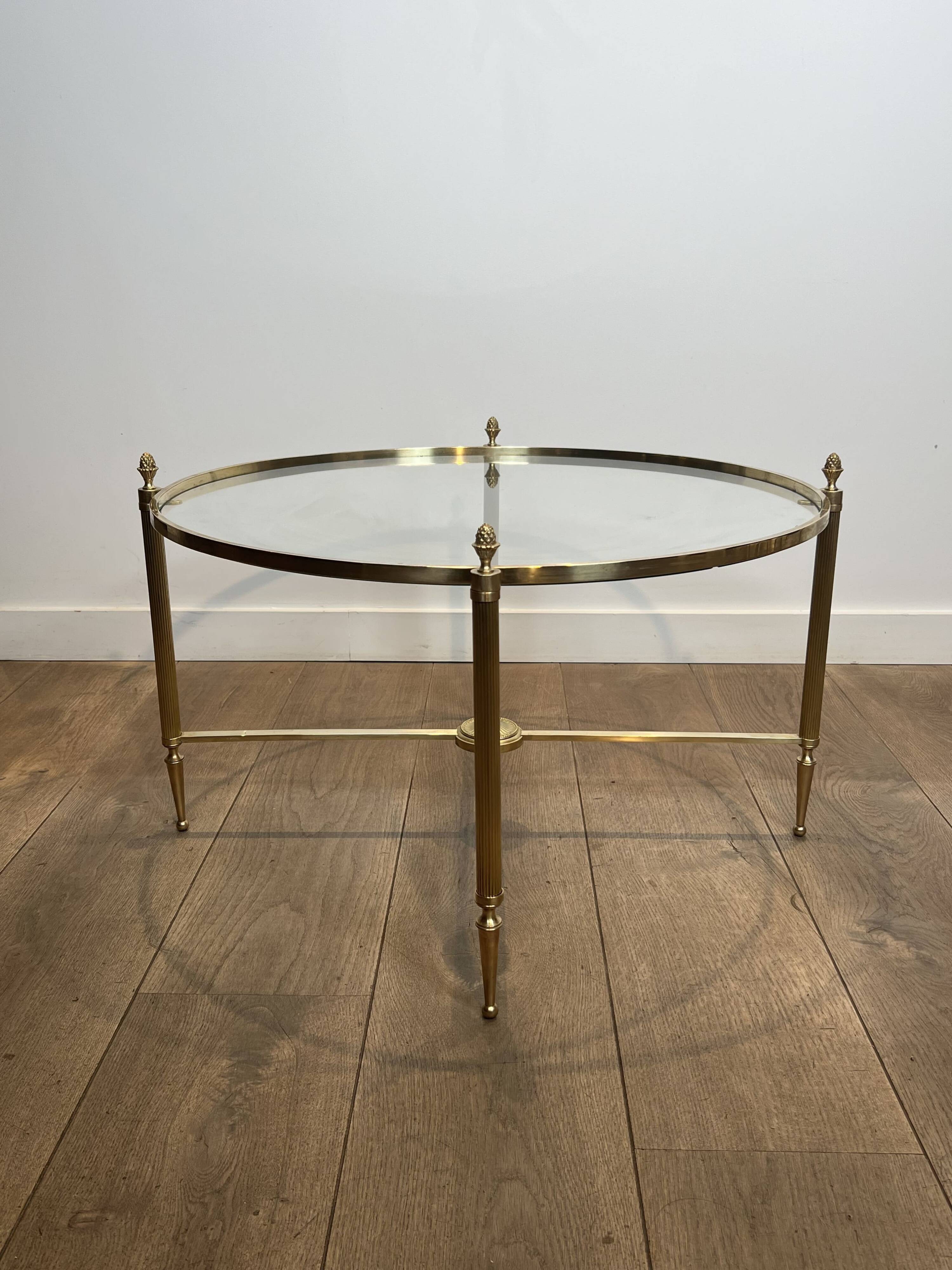 Neoclassical Round Coffee Table in Brass with Fluted Supports and Floral Motifs