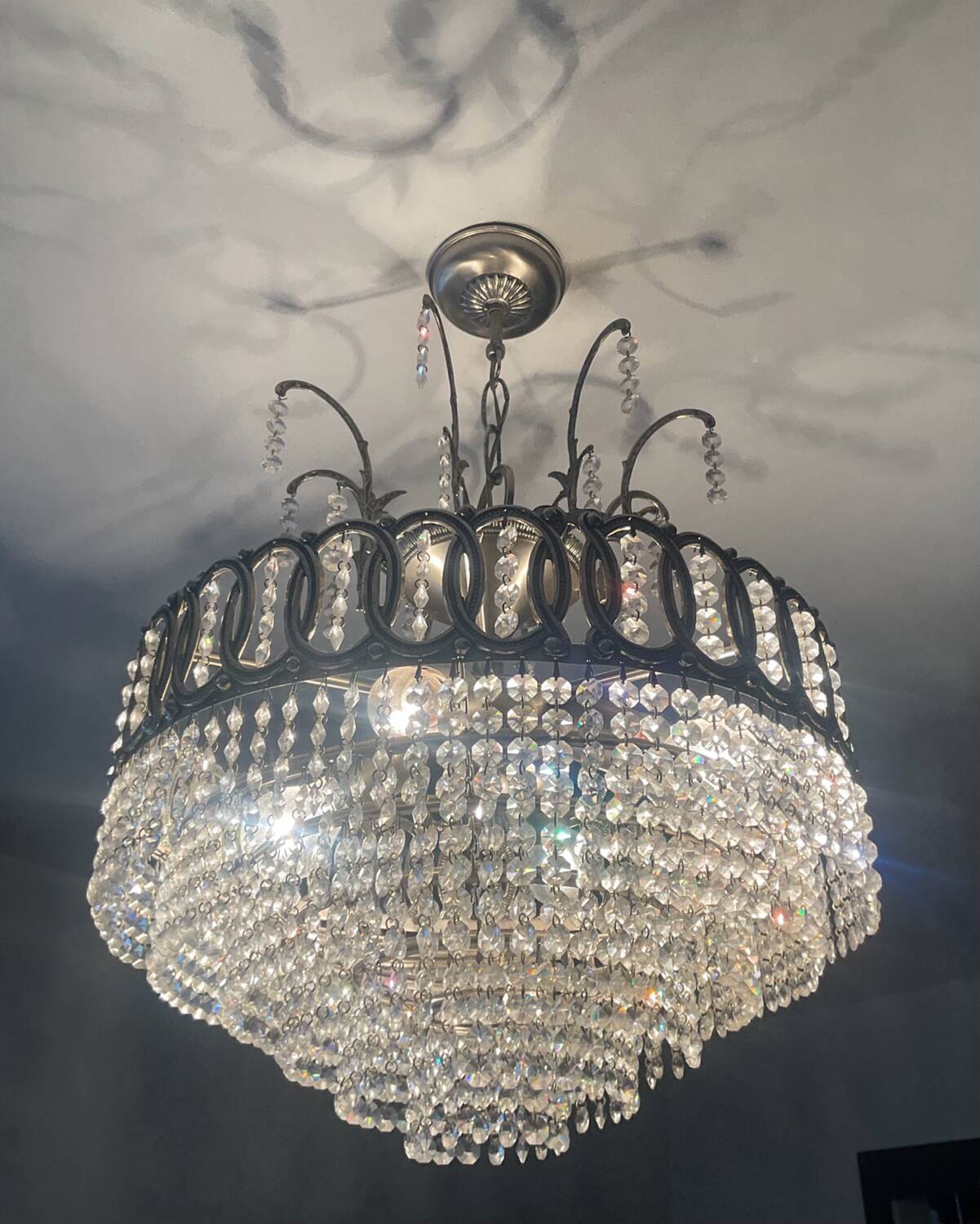 Cascading chandelier with crystal and silvered bronze pendants