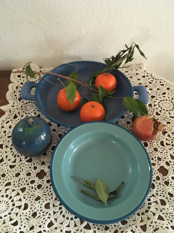 Two matching enameled dishes in green and blue
