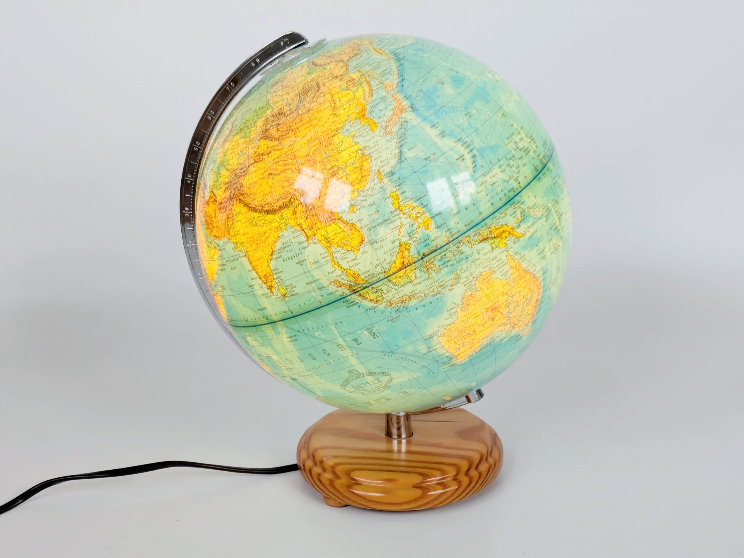 Columbus Duplex illuminated globe on a wooden base, 1980s