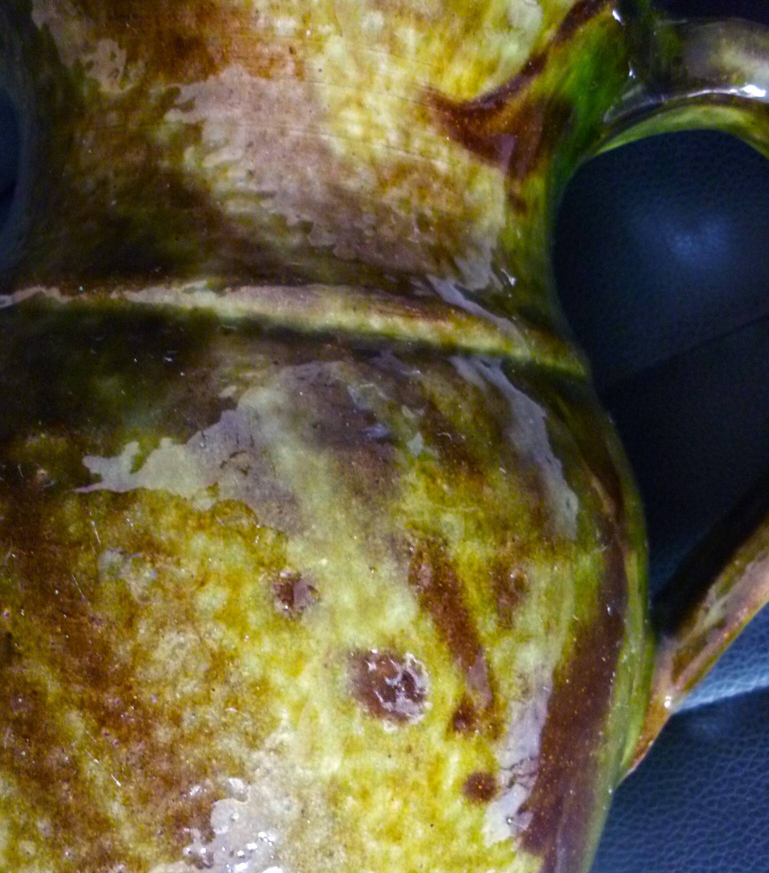 Pitcher vase, thick green glazed terracotta, signature to be identified