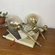 Pair of antique wall sconces torch style brass with glass globes in gold.