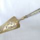 Shovel a cake in silver metal and brass