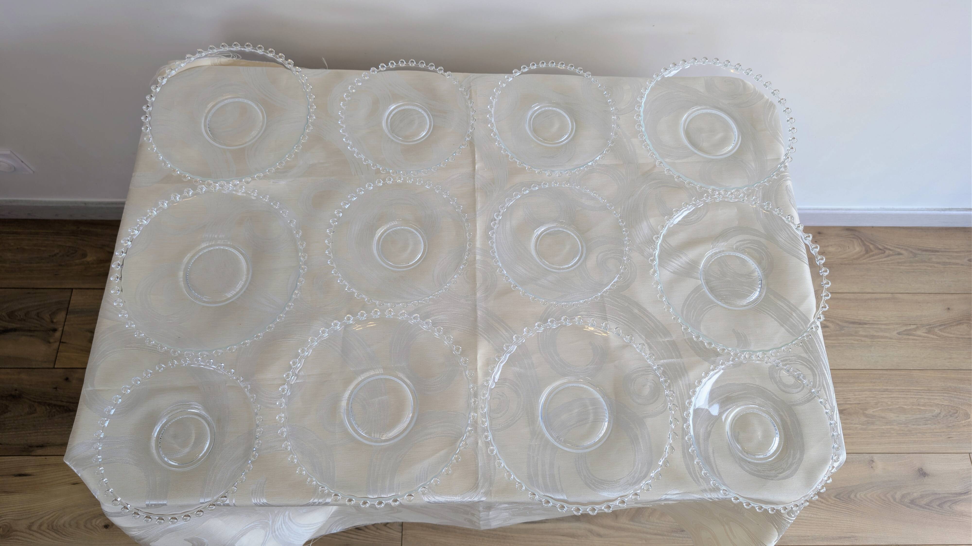 Vintage service of 12 pressed glass plates with bead decoration.