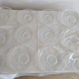Vintage service of 12 pressed glass plates with bead decoration.